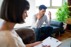 a person talks to a therapist in an intensive outpatient program for veterans 